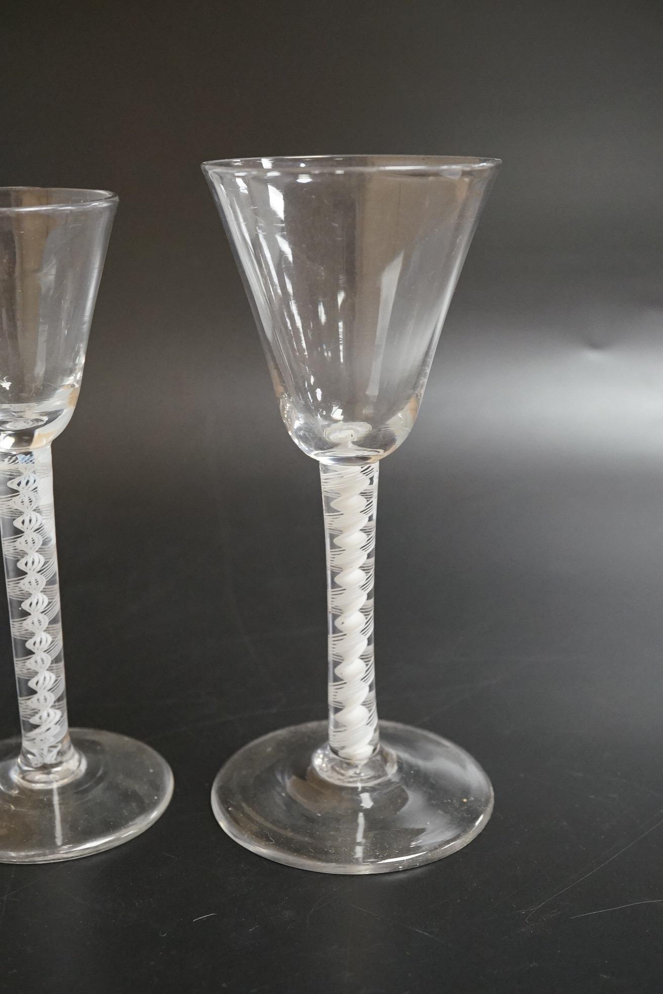Two DSOT stem wine glasses, c.1760, with funnel shaped bowls, tallest 16.5cm high